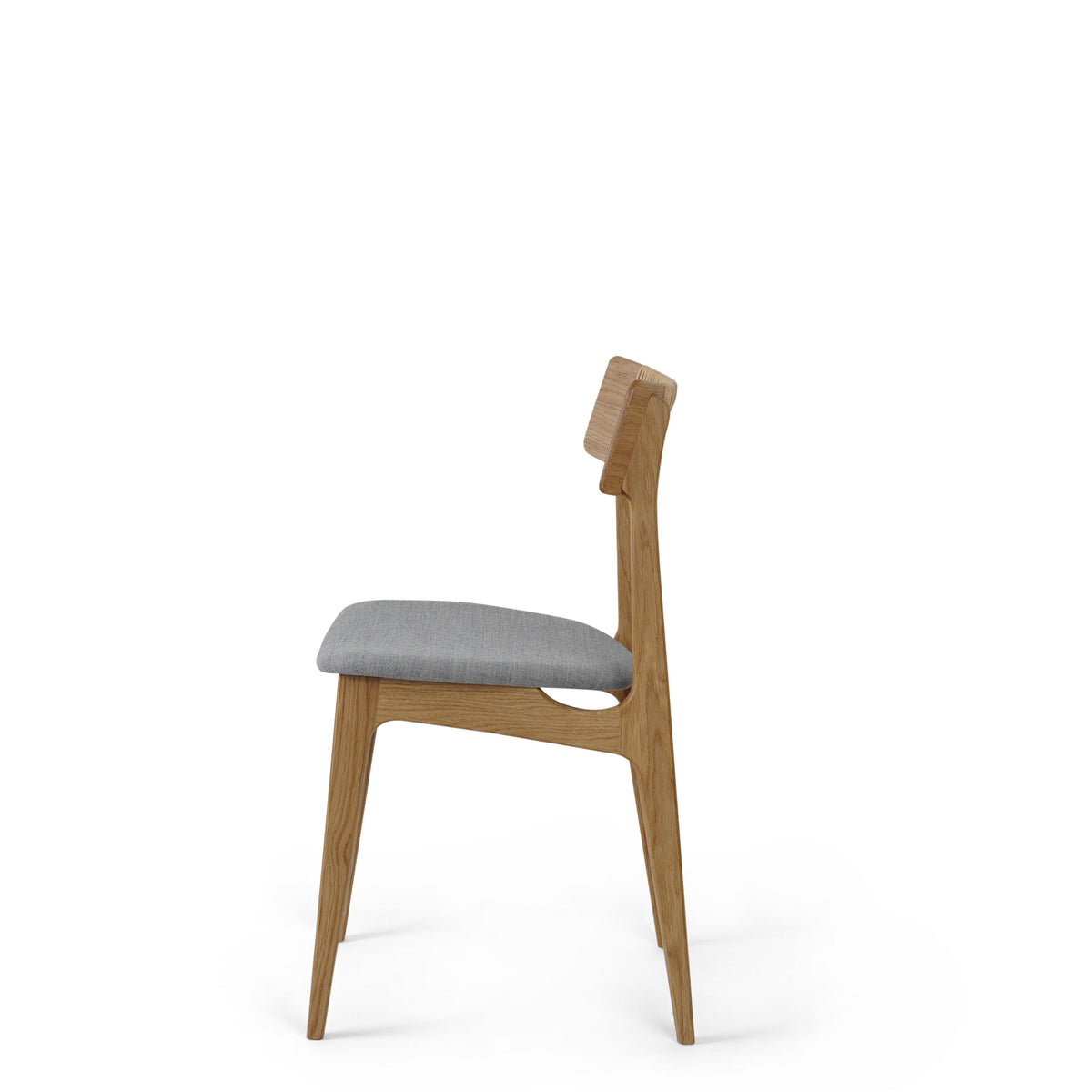 A mid-century modern wooden dining chair with a light gray upholstered seat cushion, shown from a side profile against a solid white background.