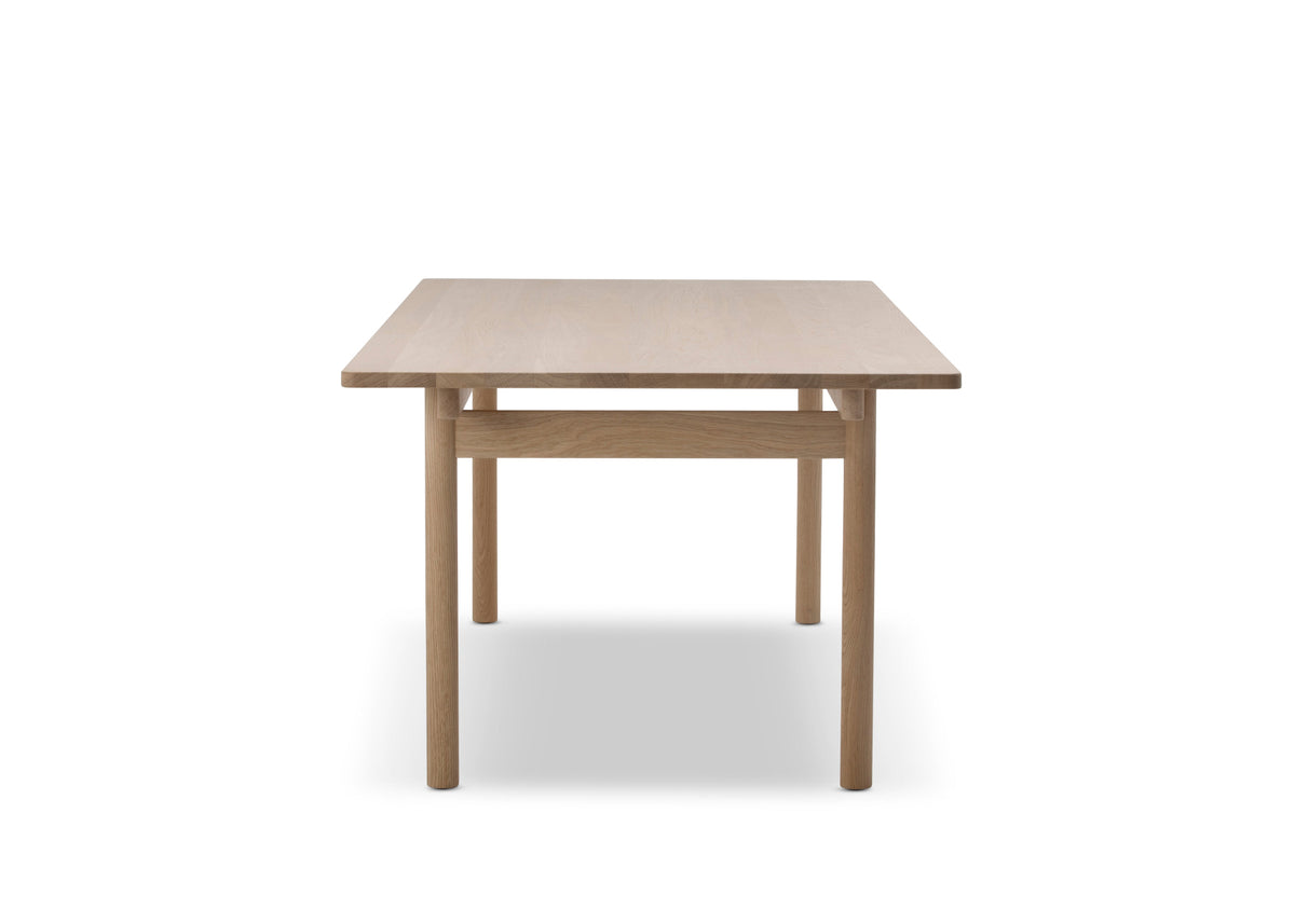 A minimalist square wooden table with a light oak finish, featuring a simple crossbar design and four straight legs, shown against a plain white background.