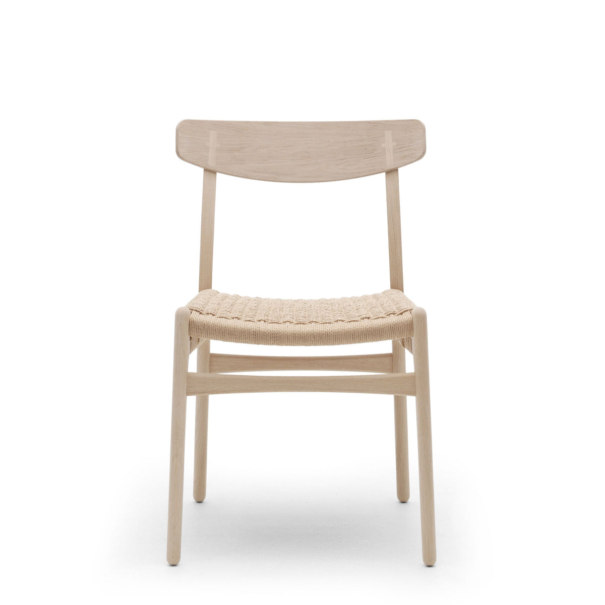 A minimalist wooden dining chair with a light natural oak frame and a woven rope seat, shown from the front against a solid white background.