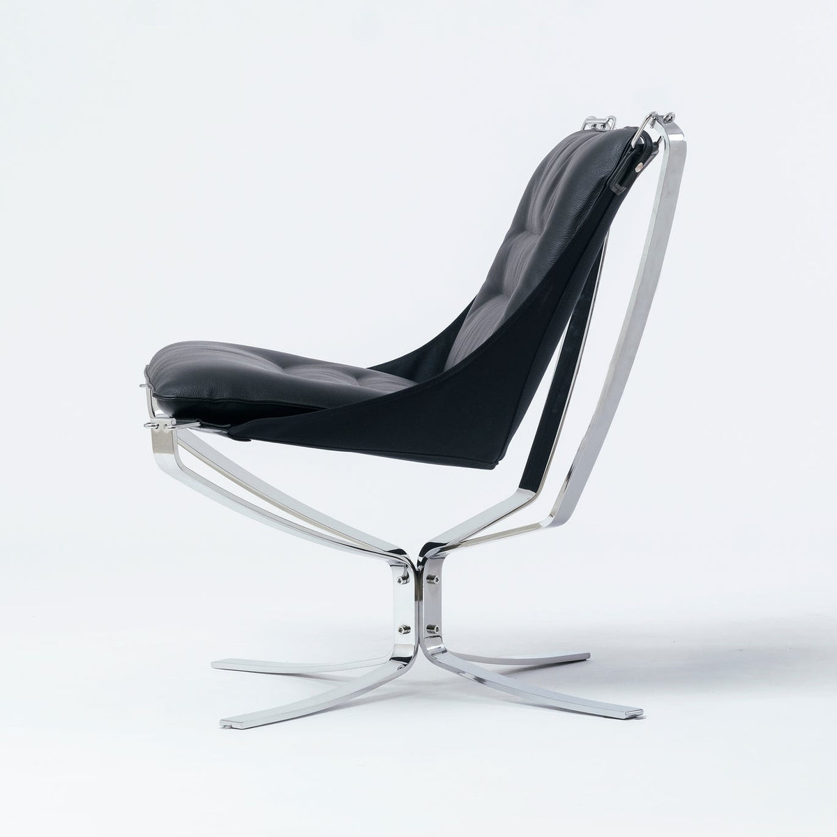 Midcentury Norwegian easy chair in black leather with chrome frame on white background 