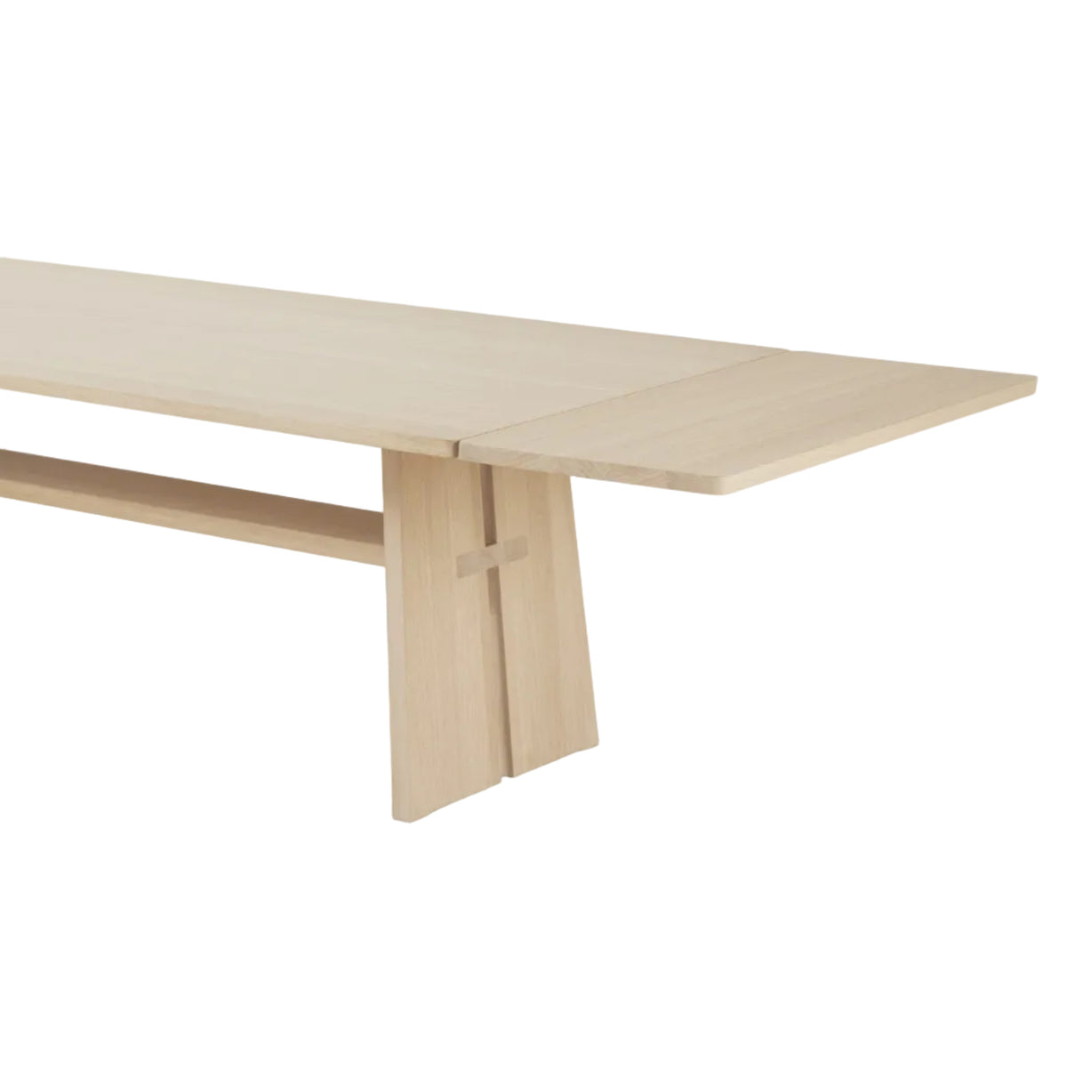 A light natural wood extendable dining table with a minimalist design, featuring a drop-leaf mechanism and a lower shelf, shown on a white background.