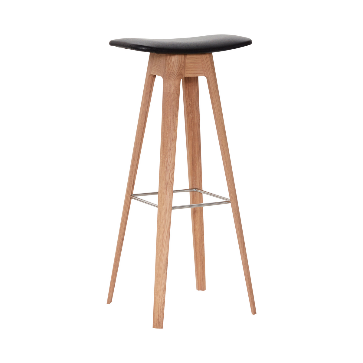 A modern bar stool with a curved black faux-leather seat and four tapered natural oak legs, featuring a thin metal footrest.