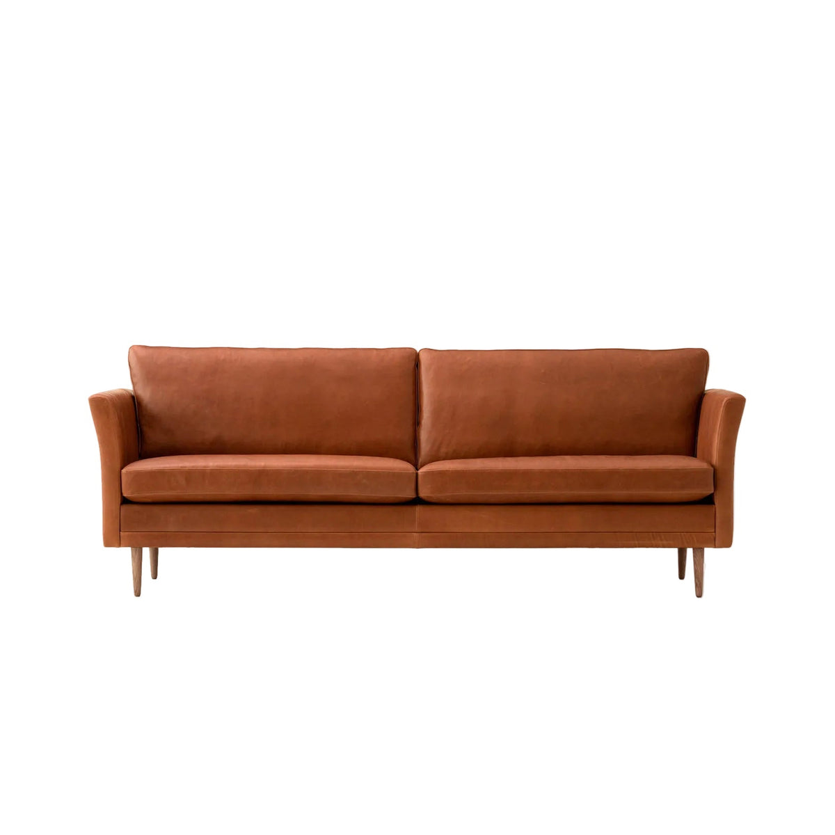 A mid-century modern two-seater sofa upholstered in warm rust-brown leather, featuring tapered wooden legs, shown against a plain white background.