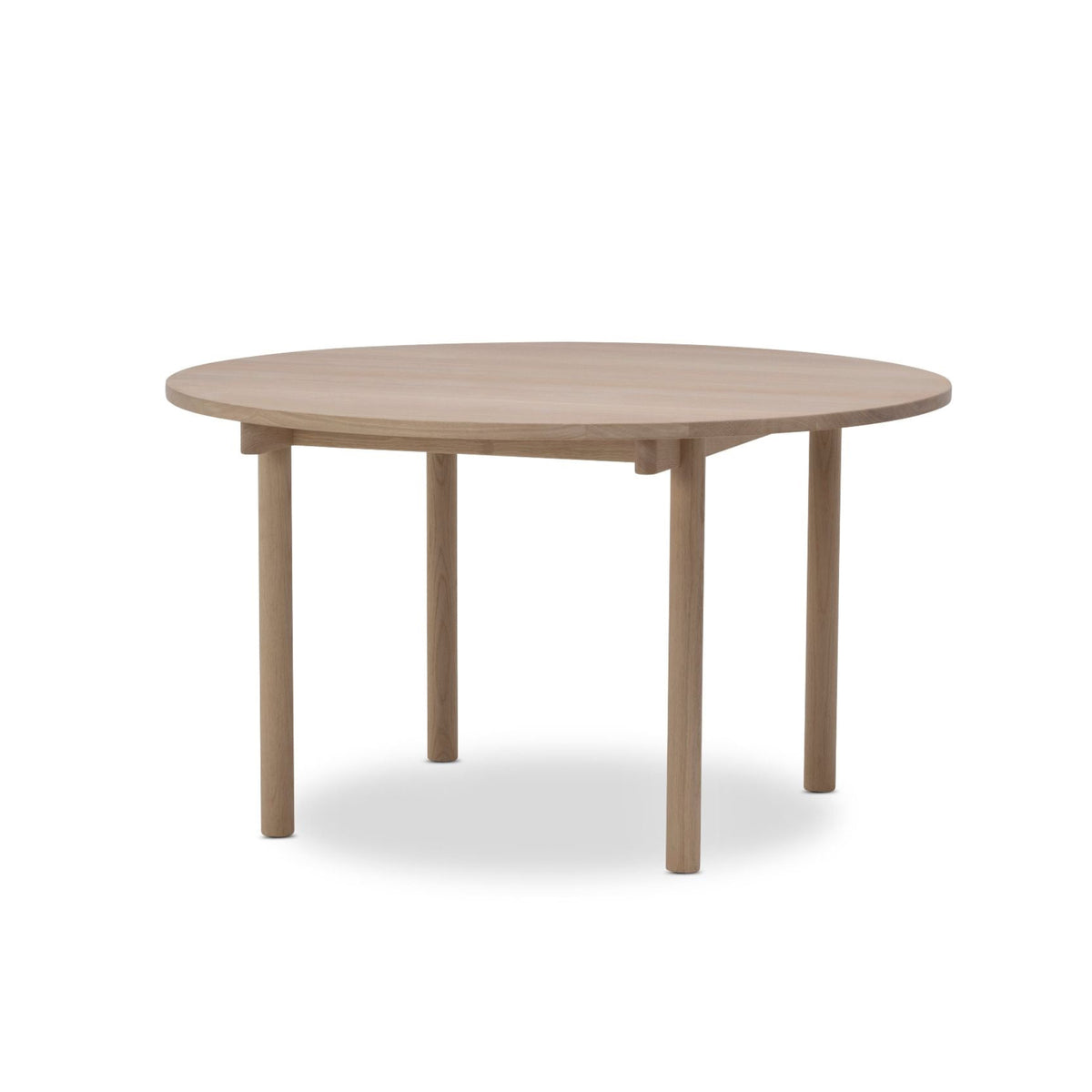 A round wooden dining table with a light natural oak finish, featuring four tapered legs and a visible drop leaf mechanism under the tabletop, shown on a solid white background.