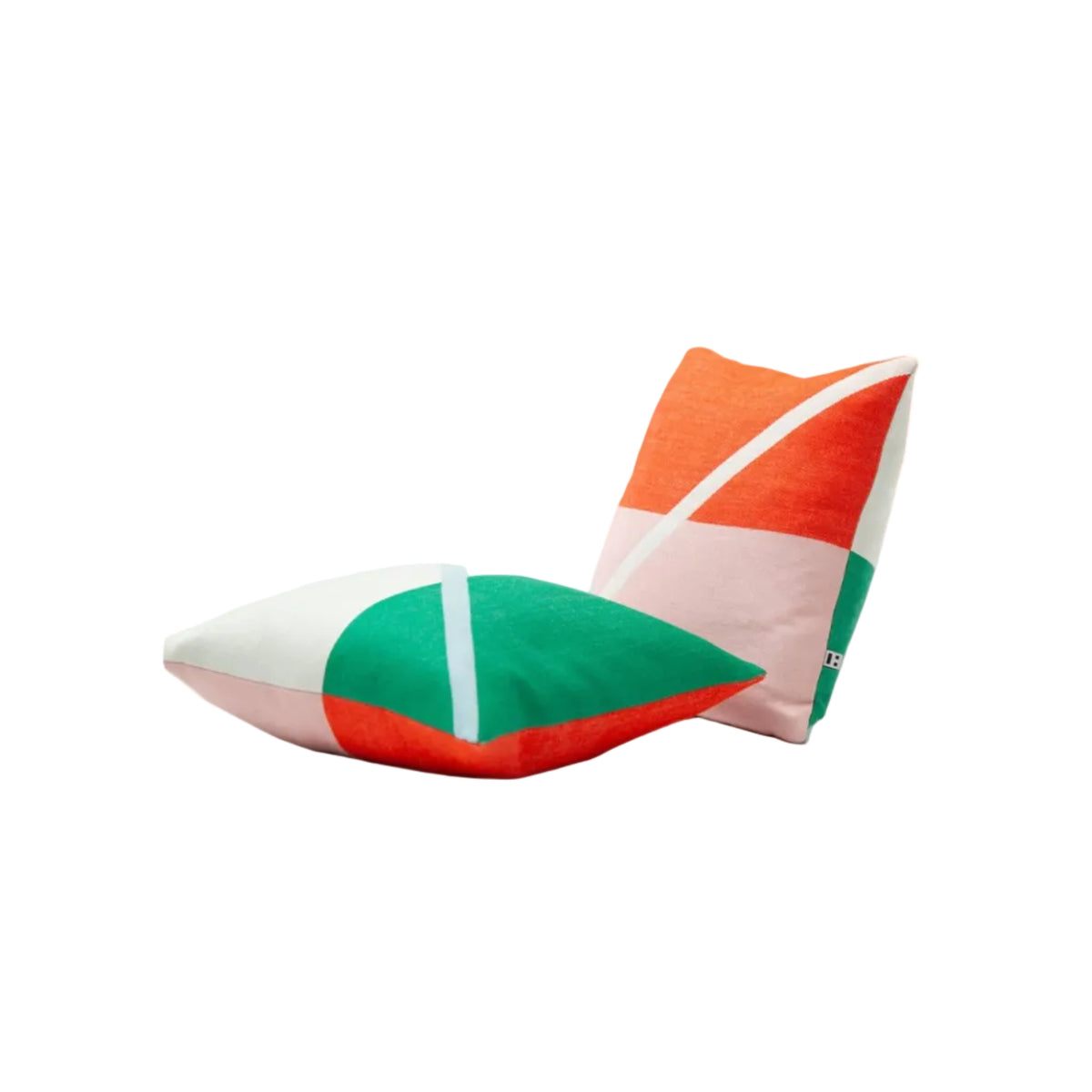 Two square throw pillows with a bold geometric color-block pattern in orange, green, pink, and white, displayed on a clean white studio background.