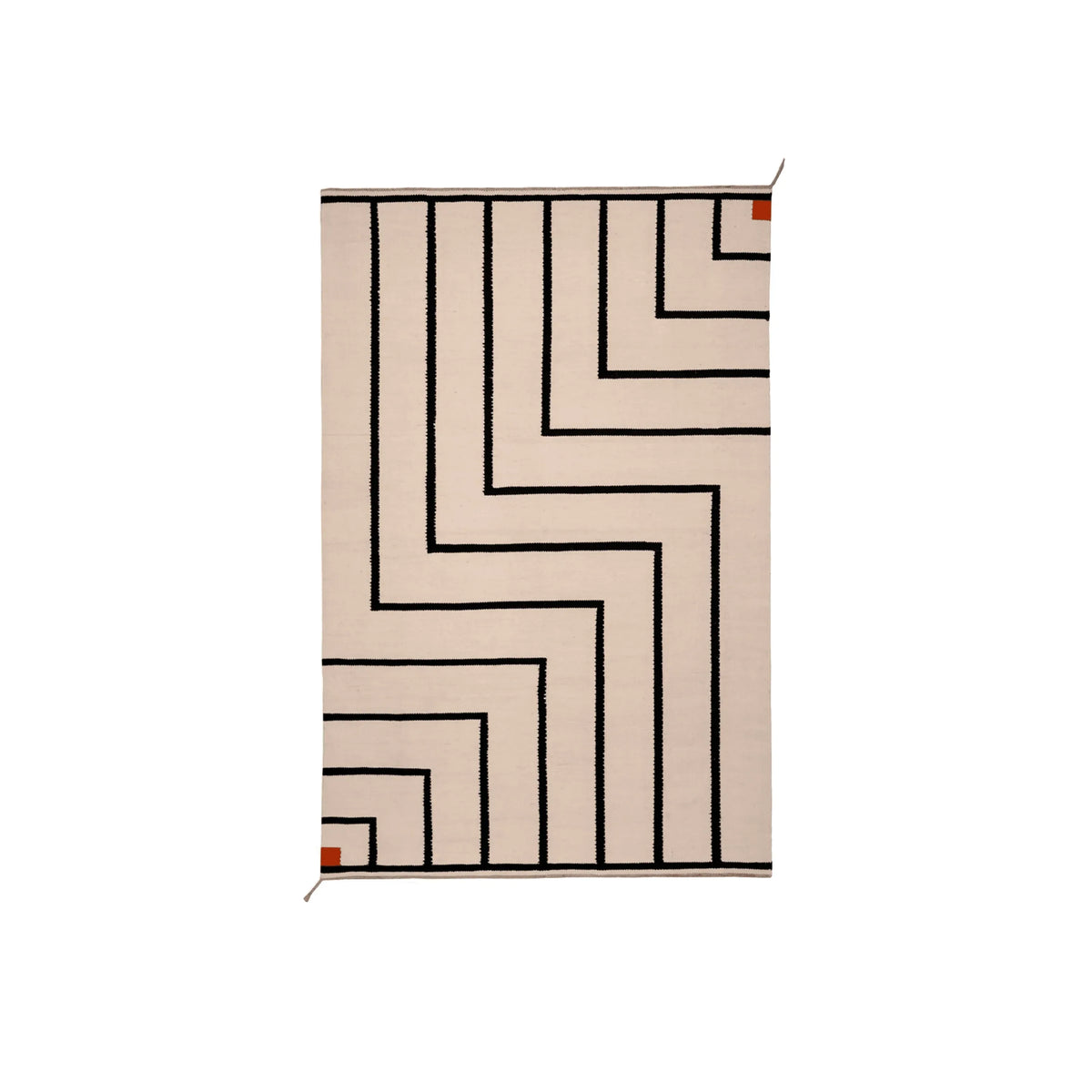 A rectangular area rug with a cream background and a bold black geometric maze-like line pattern, featuring small rust-orange corner accents.