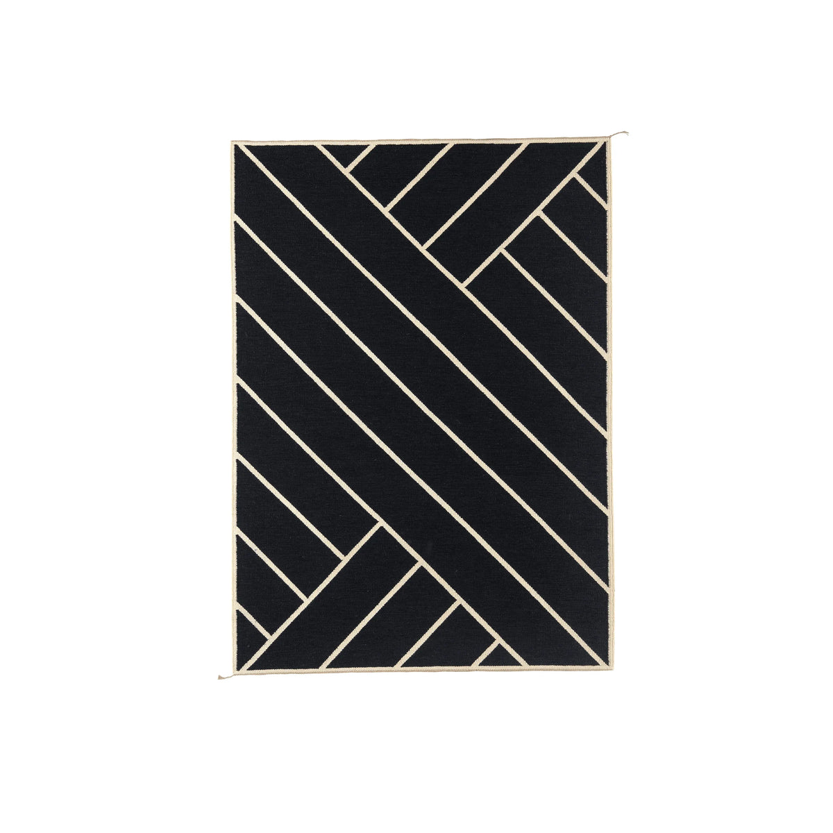 A rectangular black rug with a cream-colored geometric linear pattern, shown flat against a solid white background.