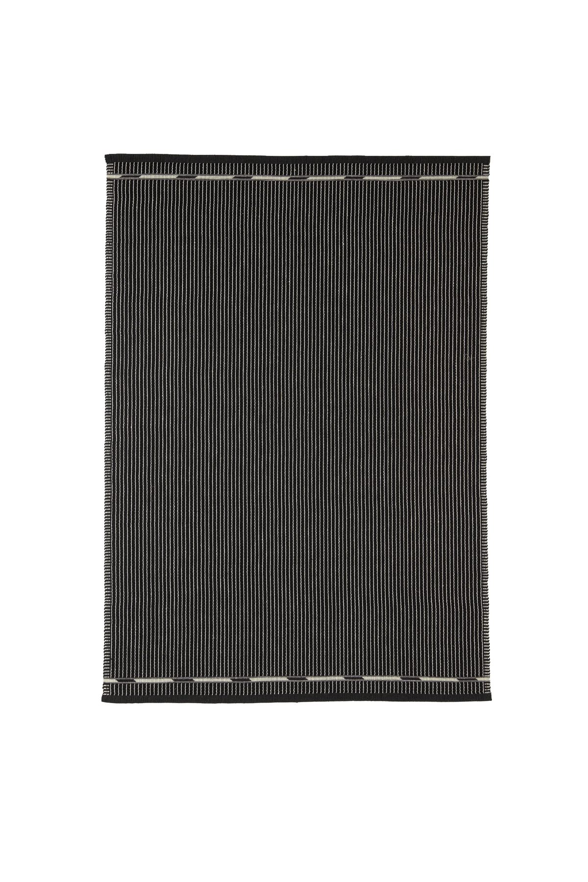 A rectangular black rug with thin vertical white stripes and contrasting white stitched borders, shown flat against a solid white background.