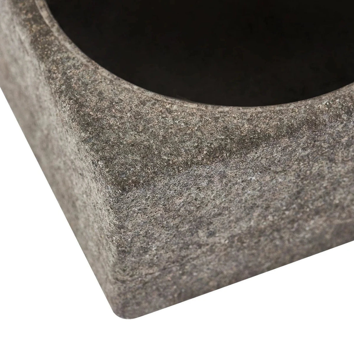 Close-up of a square granite bowl with a polished  interior, showing the textured stone surface and corner detail on a white background.